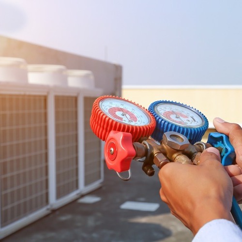 HVAC technician tests system.